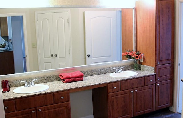 1711 Old Spanish Trl Unit 343, Houston, TX 77054 - bathroom featuring double vanity and tile patterned floors