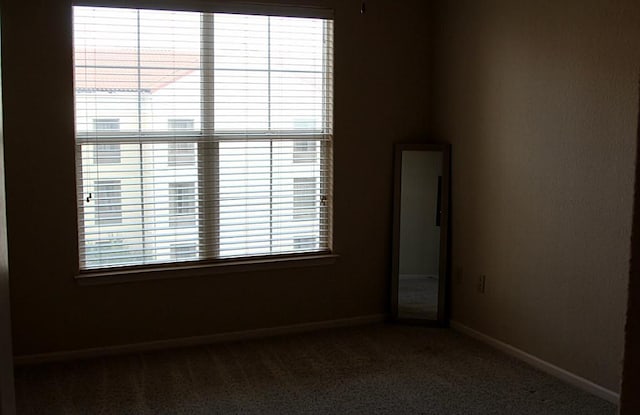 1711 Old Spanish Trl Unit 343, Houston, TX 77054 - spare room featuring carpet flooring and baseboards