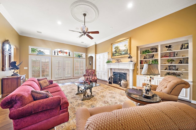 1310 Whispering Pines Dr, Houston, TX 77055 - living area with a fireplace, ceiling fan, wood finished floors, recessed lighting, and crown molding