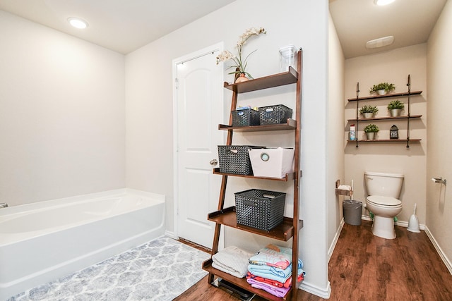 5502 Peralta Mills Way, Katy, TX 77449 - full bath with wood finished floors, a bath, and recessed lighting