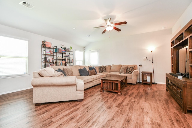 5502 Peralta Mills Way, Katy, TX 77449 - living area featuring light wood finished floors, ceiling fan, and lofted ceiling
