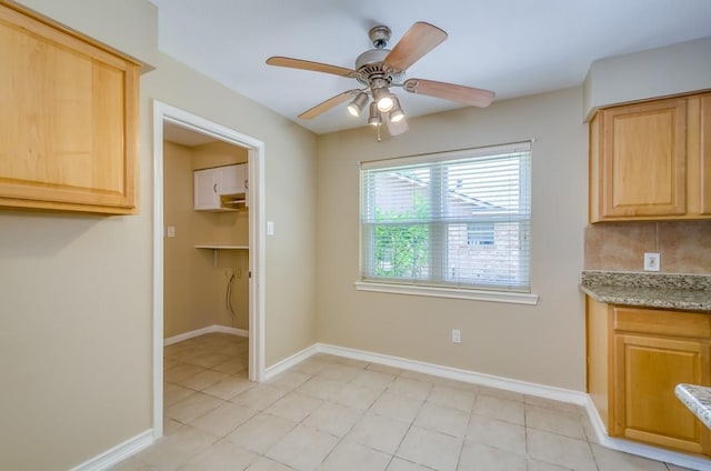 15622 Sunset Rock Dr, Houston, TX 77084 - unfurnished dining area featuring a ceiling fan and baseboards