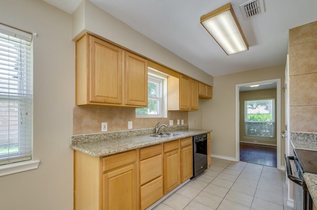 15622 Sunset Rock Dr, Houston, TX 77084 - kitchen featuring light brown cabinets, light tile patterned floors, light countertops, and plenty of natural light