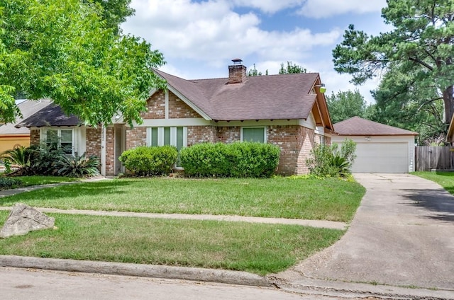 15622 Sunset Rock Dr, Houston, TX 77084 - view of front facade with brick siding, a front yard, a shingled roof, a chimney, and concrete driveway