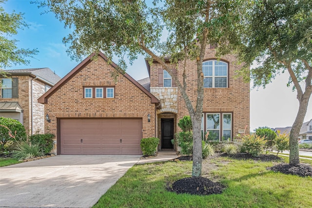 11023 Honey Suckle Haven Dr, Cypress, TX 77433 - traditional home featuring brick siding, concrete driveway, a garage, stone siding, and a front yard