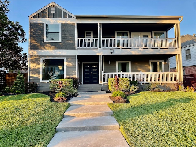 3359 Ozark St, Houston, TX 77021 - view of front facade featuring a balcony, a front lawn, and a porch