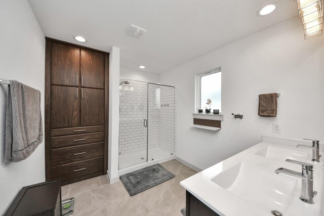 29506 Hartman Holw, Katy, TX 77494 - full bath featuring a stall shower, double vanity, tile patterned floors, and recessed lighting