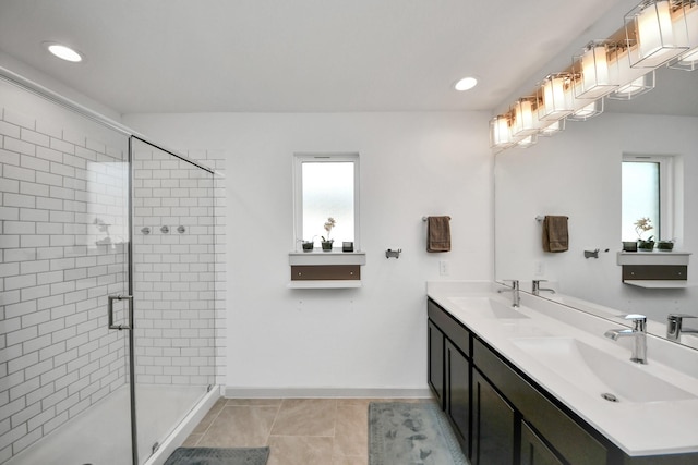 29506 Hartman Holw, Katy, TX 77494 - bathroom with double vanity, a shower stall, recessed lighting, and tile patterned flooring