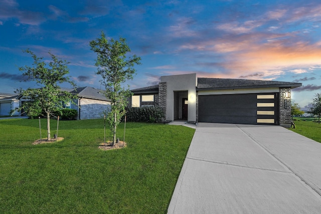 29506 Hartman Holw, Katy, TX 77494 - contemporary home with driveway, a garage, a lawn, and stucco siding