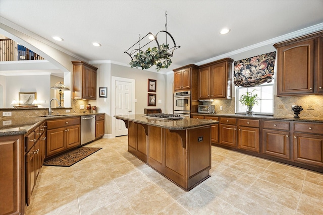 15410 Stable Star Cir, Cypress, TX 77429 - kitchen with appliances with stainless steel finishes, crown molding, a center island, dark stone countertops, and recessed lighting