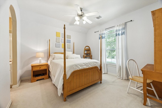 15410 Stable Star Cir, Cypress, TX 77429 - bedroom with light carpet, arched walkways, and ceiling fan