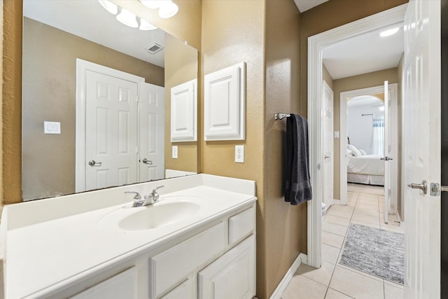 15410 Stable Star Cir, Cypress, TX 77429 - bathroom featuring tile patterned flooring, vanity, and connected bathroom