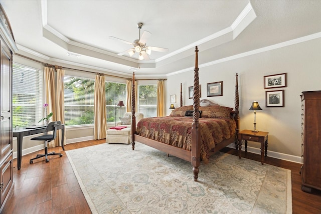 15410 Stable Star Cir, Cypress, TX 77429 - bedroom with a raised ceiling, ornamental molding, multiple windows, wood finished floors, and an office area