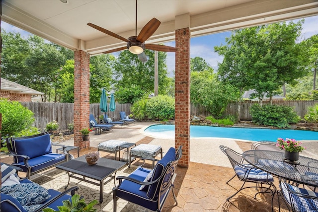 15410 Stable Star Cir, Cypress, TX 77429 - fenced backyard with ceiling fan, a patio, and an outdoor hangout area