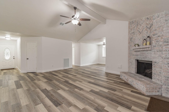 3805 Youpon Dr, La Porte, TX 77571 - unfurnished living room featuring a fireplace, ceiling fan, and wood finished floors