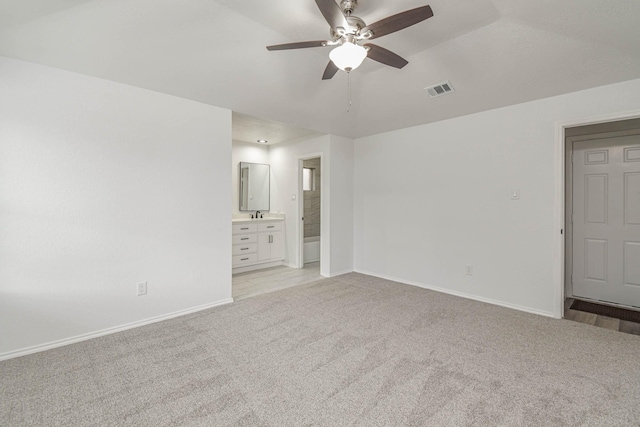 3805 Youpon Dr, La Porte, TX 77571 - unfurnished bedroom with light colored carpet, connected bathroom, and ceiling fan