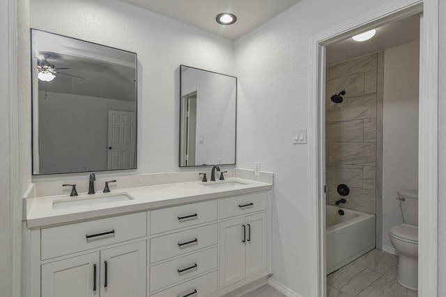 3805 Youpon Dr, La Porte, TX 77571 - full bathroom featuring double vanity, marble finish floors, shower / bath combination, and ceiling fan