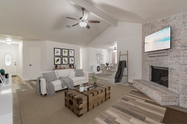 3805 Youpon Dr, La Porte, TX 77571 - living area with wood finished floors, ceiling fan, and a fireplace