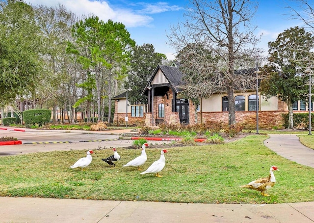 4311 Walden Terrace Ln, Humble, TX 77396 - view of front of home featuring a front yard and brick siding