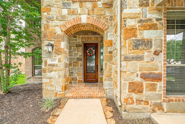 4311 Walden Terrace Ln, Humble, TX 77396 - doorway to property featuring stone siding and brick siding