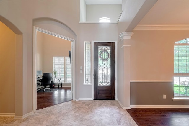4311 Walden Terrace Ln, Humble, TX 77396 - foyer entrance featuring arched walkways and crown molding