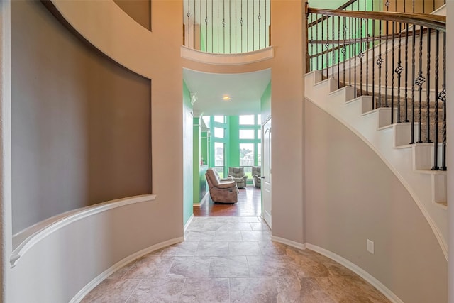 4311 Walden Terrace Ln, Humble, TX 77396 - hallway featuring a high ceiling and stairs