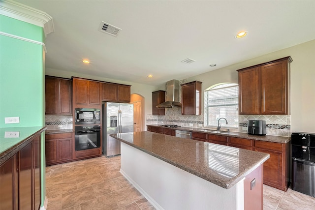 4311 Walden Terrace Ln, Humble, TX 77396 - kitchen featuring black appliances, wall chimney exhaust hood, a center island, dark stone counters, and tasteful backsplash