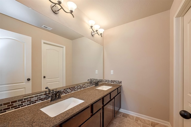 4311 Walden Terrace Ln, Humble, TX 77396 - full bathroom with double vanity and baseboards