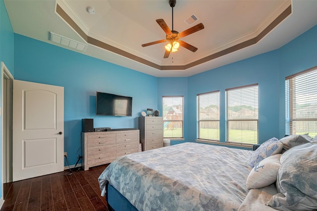 4311 Walden Terrace Ln, Humble, TX 77396 - bedroom with a raised ceiling, dark wood finished floors, ornamental molding, and a ceiling fan