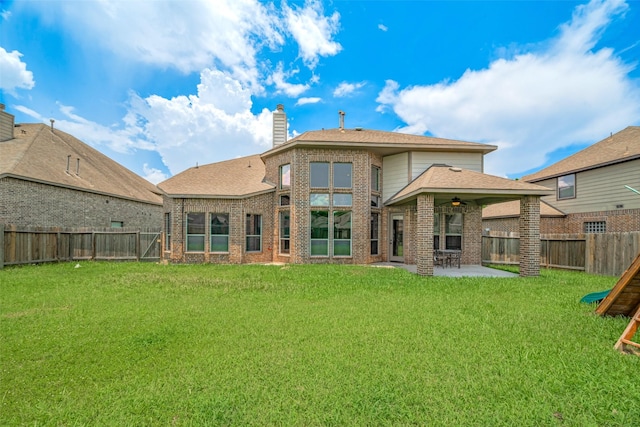 4311 Walden Terrace Ln, Humble, TX 77396 - rear view of house with a patio, brick siding, a ceiling fan, and a fenced backyard