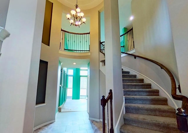 4311 Walden Terrace Ln, Humble, TX 77396 - stairway featuring a chandelier and baseboards