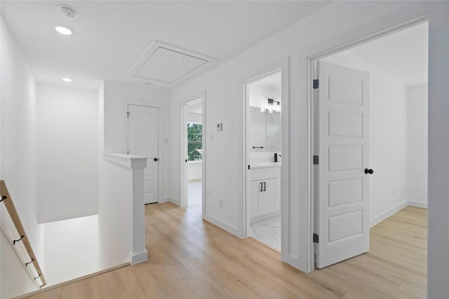 7504 Laura Koppe Rd C/D, Unit C/D Houston, TX 77028 - corridor featuring an upstairs landing, attic access, light wood finished floors, and recessed lighting