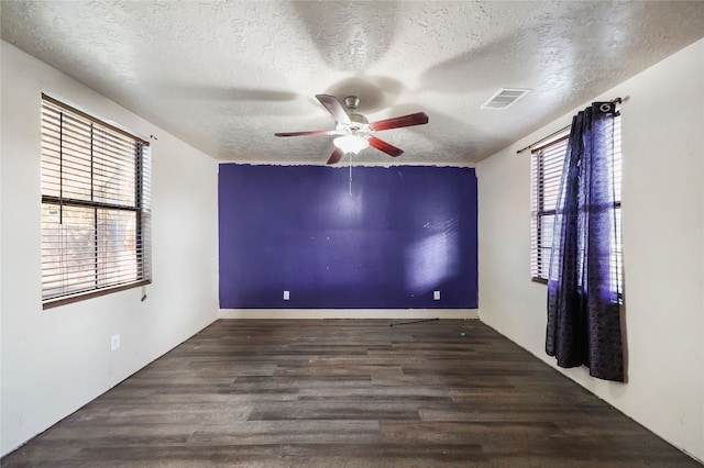 7209 Ave K, Houston, TX 77011 - spare room featuring a textured ceiling, ceiling fan, and wood finished floors