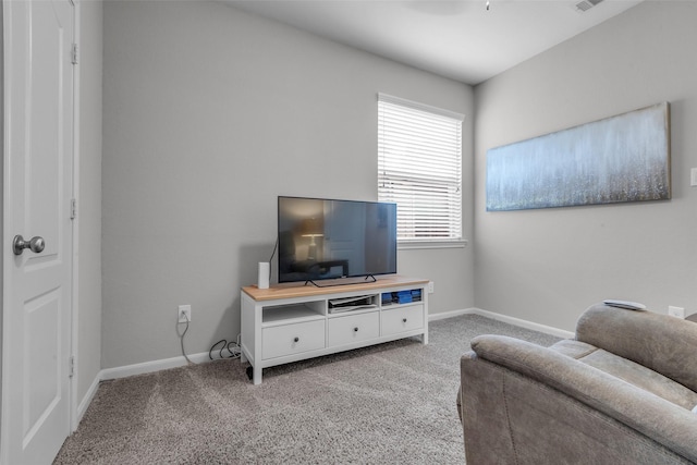 6423 Hunters Creek Ln, Baytown, TX 77521 - carpeted living room featuring baseboards