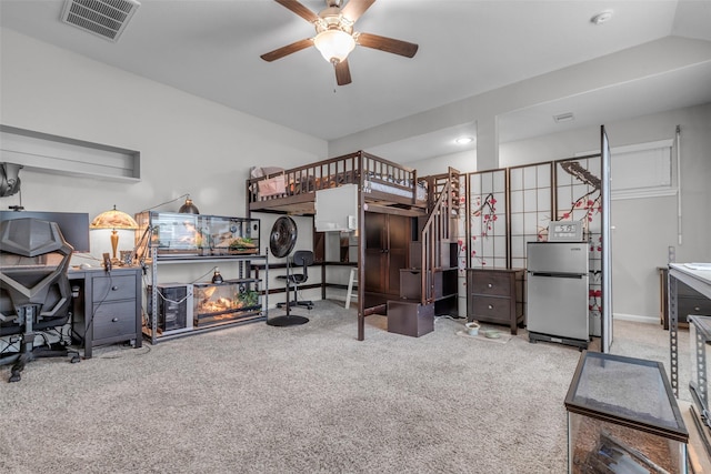 6423 Hunters Creek Ln, Baytown, TX 77521 - bedroom with freestanding refrigerator and carpet
