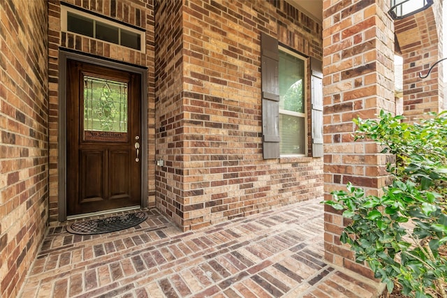 6423 Hunters Creek Ln, Baytown, TX 77521 - view of exterior entry with brick siding and covered porch