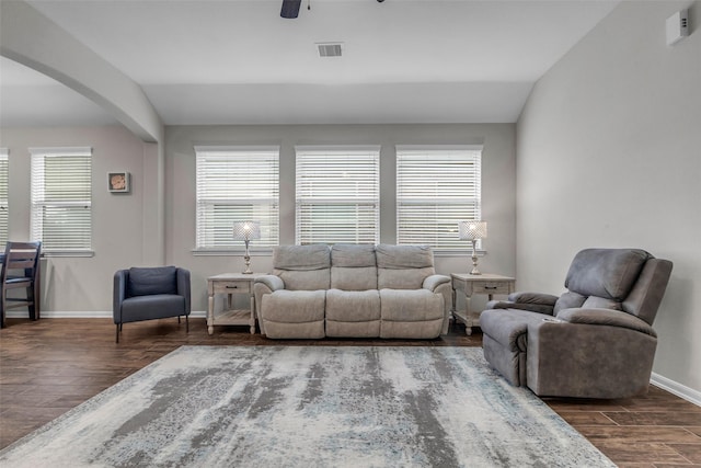 6423 Hunters Creek Ln, Baytown, TX 77521 - living area featuring arched walkways, dark wood-type flooring, a ceiling fan, and vaulted ceiling
