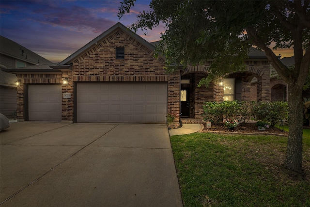 6423 Hunters Creek Ln, Baytown, TX 77521 - view of front of house with concrete driveway, an attached garage, brick siding, and a lawn