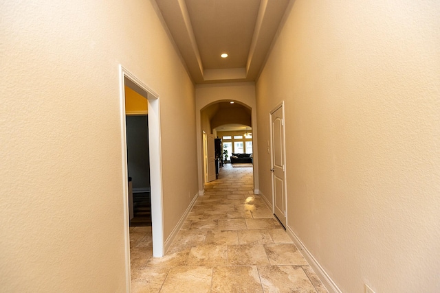 4015 Teramo Ln, Katy, TX 77493 - corridor featuring arched walkways, stone tile floors, and recessed lighting