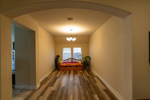 4015 Teramo Ln, Katy, TX 77493 - corridor with arched walkways, dark wood-type flooring, and a chandelier