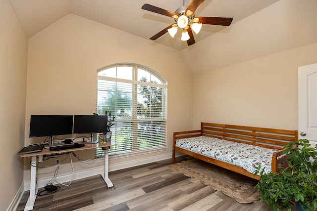 4015 Teramo Ln, Katy, TX 77493 - bedroom featuring lofted ceiling, multiple windows, wood finished floors, a desk, and ceiling fan