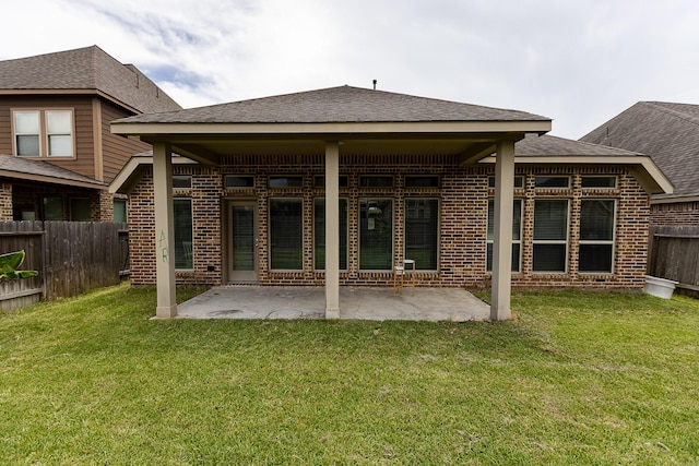 4015 Teramo Ln, Katy, TX 77493 - rear view of house featuring brick siding, a fenced backyard, a patio, and a shingled roof