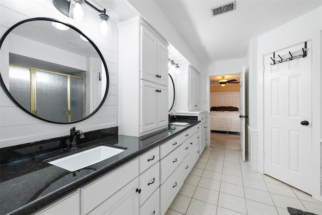 6702 Seinfeld Ct, Houston, TX 77069 - bathroom featuring double vanity, tile patterned floors, ensuite bathroom, a shower stall, and ceiling fan