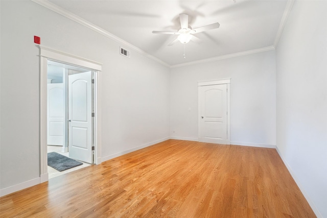 2802 Morrison St Unit 203, Houston, TX 77009 - spare room featuring light wood-style floors, ornamental molding, and ceiling fan