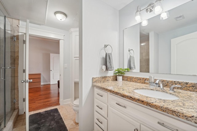 2802 Morrison St Unit 203, Houston, TX 77009 - full bathroom with vanity, a stall shower, and stone tile flooring