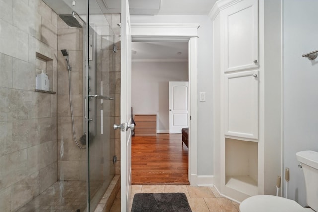 2802 Morrison St Unit 203, Houston, TX 77009 - full bathroom featuring crown molding, a shower stall, and tile patterned flooring