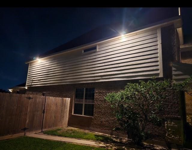 2547 Crystal Shore Dr, Rosharon, TX 77583 - view of property exterior at twilight