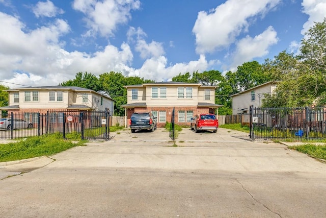 8126 Jutland Rd, Houston, TX 77033 - view of property featuring brick siding and uncovered parking
