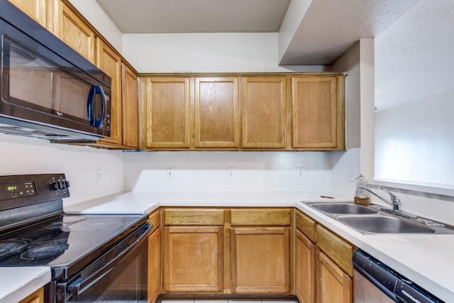 8126 Jutland Rd, Houston, TX 77033 - kitchen featuring black appliances, light countertops, and brown cabinets