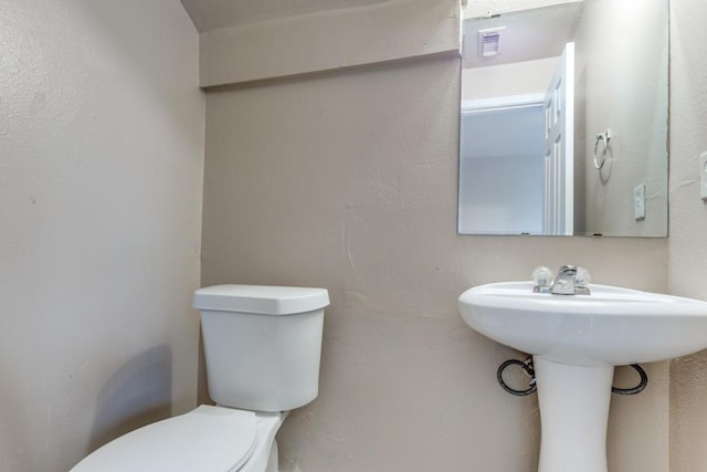 8126 Jutland Rd, Houston, TX 77033 - half bath featuring toilet and a sink